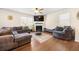 Living room with fireplace, ceiling fan, modern furniture and lots of natural light at 111 Centennial Ridge Dr, Acworth, GA 30102