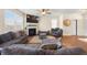 Living room with fireplace, ceiling fan, modern furniture and lots of natural light at 111 Centennial Ridge Dr, Acworth, GA 30102