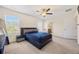 Spacious main bedroom with contemporary furniture set, neutral carpet, and bright natural light at 111 Centennial Ridge Dr, Acworth, GA 30102
