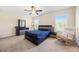 Spacious main bedroom with contemporary furniture set, neutral carpet, and bright natural light at 111 Centennial Ridge Dr, Acworth, GA 30102