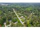 Aerial view of a quiet neighborhood surrounded by mature trees at 141 Springbrooke Trl, Dallas, GA 30157