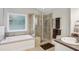 Bathroom featuring a soaking tub and tiled shower at 141 Springbrooke Trl, Dallas, GA 30157