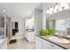 Bathroom featuring dual sinks, walk-in shower, and linen storage at 141 Springbrooke Trl, Dallas, GA 30157