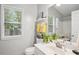 Bright bathroom with updated vanity, toilet and mirror at 141 Springbrooke Trl, Dallas, GA 30157