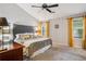 Spacious bedroom with a ceiling fan and large windows at 141 Springbrooke Trl, Dallas, GA 30157
