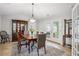 Dining room features a large table and access to the backyard at 141 Springbrooke Trl, Dallas, GA 30157