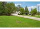 Long driveway, mature trees, and a well manicured lawn make this home feel like a peaceful retreat at 141 Springbrooke Trl, Dallas, GA 30157