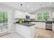 Bright kitchen offers updated countertops and stainless appliances at 141 Springbrooke Trl, Dallas, GA 30157