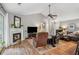Cozy living room features a fireplace, wood floors, and neutral colors at 141 Springbrooke Trl, Dallas, GA 30157
