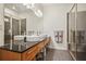 Modern bathroom featuring double sinks, granite countertops, and a glass-enclosed shower at 1430 Dresden Ne Dr # 230, Brookhaven, GA 30319