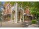 Inviting brick building featuring arched entrance and street-side appeal, creating a welcoming atmosphere at 1430 Dresden Ne Dr # 230, Brookhaven, GA 30319