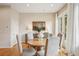 Warm and inviting dining room featuring hardwood floors and natural light from large windows at 1430 Dresden Ne Dr # 230, Brookhaven, GA 30319