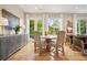 Charming dining room with hardwood floors, complemented by stylish furnishings and natural light from the large windows at 1430 Dresden Ne Dr # 230, Brookhaven, GA 30319