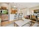 Cozy living room showcasing hardwood floors, seating area, and barstool seating at the kitchen counter at 1430 Dresden Ne Dr # 230, Brookhaven, GA 30319
