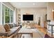 Inviting living room with hardwood floors, a large window, and a media center with a flat screen TV at 1430 Dresden Ne Dr # 230, Brookhaven, GA 30319