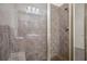 Modern shower featuring tile surround and glass doors at 1430 Dresden Ne Dr # 230, Brookhaven, GA 30319