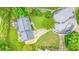 Aerial view of home on landscaped lot with stone driveway, beautiful trees, and a well-maintained lawn at 2801 Holly Oaks Dr, Marietta, GA 30062