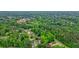 Aerial view showcases a community surrounded by dense trees and lush greenery at 2801 Holly Oaks Dr, Marietta, GA 30062