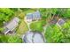 An aerial view of a beautiful brick home with lush landscaping and a three-car garage at 2801 Holly Oaks Dr, Marietta, GA 30062