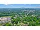 A high aerial view showcases a residential community surrounded by trees and greenery at 2801 Holly Oaks Dr, Marietta, GA 30062