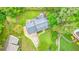 Overhead view of home with large lot, lush landscaping, manicured lawn, and inviting outdoor fire pit area at 2801 Holly Oaks Dr, Marietta, GA 30062