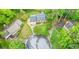 Aerial view of a home in a cul-de-sac, surrounded by lush greenery and mature trees at 2801 Holly Oaks Dr, Marietta, GA 30062