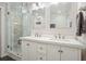 Modern bathroom featuring dual sinks, a glass-enclosed shower, and stylish fixtures at 2801 Holly Oaks Dr, Marietta, GA 30062
