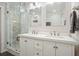 Elegant bathroom featuring double sink vanity, walk-in shower and modern fixtures at 2801 Holly Oaks Dr, Marietta, GA 30062