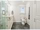 Bathroom with modern fixtures, tiled floors, and a glass enclosed shower at 2801 Holly Oaks Dr, Marietta, GA 30062