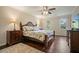 Comfortable bedroom features hardwood floors, a ceiling fan and ample natural light from two windows at 2801 Holly Oaks Dr, Marietta, GA 30062