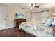 Bedroom with hardwood floors, ceiling fan, a flat screen television, and barn door at 2801 Holly Oaks Dr, Marietta, GA 30062