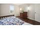 This bedroom features hardwood floors, neutral walls, and a window offering natural light at 2801 Holly Oaks Dr, Marietta, GA 30062