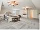 Bright, large bedroom offers a carpeted floor, fan, and a stylish wet bar with cabinet storage at 2801 Holly Oaks Dr, Marietta, GA 30062