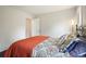 Bedroom with wood floors, a patterned comforter, and a large window at 2801 Holly Oaks Dr, Marietta, GA 30062