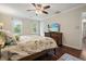 Bright bedroom features a ceiling fan, hardwood floors, and a flat screen television at 2801 Holly Oaks Dr, Marietta, GA 30062