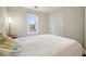 Neutral bedroom features a double closet, a window view, and light colored walls at 2801 Holly Oaks Dr, Marietta, GA 30062