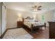 Comfortable bedroom features hardwood floors, a ceiling fan and ample natural light from two windows at 2801 Holly Oaks Dr, Marietta, GA 30062