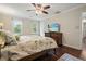 Bright bedroom with hardwood floors, two windows, and a flatscreen TV at 2801 Holly Oaks Dr, Marietta, GA 30062