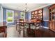 Cozy dining room with hardwood floors, natural light, and a classic wooden table at 2801 Holly Oaks Dr, Marietta, GA 30062