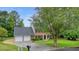 Charming two-story brick home with a well-manicured lawn and a two-car garage at 2801 Holly Oaks Dr, Marietta, GA 30062
