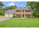 Charming two-story brick home with a well-manicured lawn and a two-car garage at 2801 Holly Oaks Dr, Marietta, GA 30062