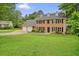 Charming brick home with a well-manicured lawn and a two-car garage at 2801 Holly Oaks Dr, Marietta, GA 30062