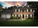 Charming brick home with manicured lawn, black shutters, and a two-car garage at 2801 Holly Oaks Dr, Marietta, GA 30062
