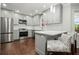 Modern kitchen featuring stainless appliances, subway tile backsplash, and a breakfast bar with seating at 2801 Holly Oaks Dr, Marietta, GA 30062