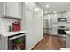 Modern kitchen with stainless steel appliances, hardwood floors, and a convenient wine cooler at 2801 Holly Oaks Dr, Marietta, GA 30062