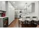Contemporary kitchen with gray cabinetry, wine cooler, and breakfast bar for casual dining at 2801 Holly Oaks Dr, Marietta, GA 30062
