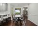 Bright breakfast nook with table and chairs, complemented by views of screened porch and open kitchen at 2801 Holly Oaks Dr, Marietta, GA 30062