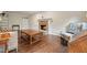 Inviting living room boasts a brick fireplace, hardwood floors, and built-in shelving at 2801 Holly Oaks Dr, Marietta, GA 30062