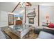 Stylish living room with stone fireplace, vaulted ceiling, unique coffee table and ample seating at 2801 Holly Oaks Dr, Marietta, GA 30062