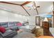 Spacious living room with vaulted ceilings, stone fireplace, exposed beams, and hardwood floors at 2801 Holly Oaks Dr, Marietta, GA 30062